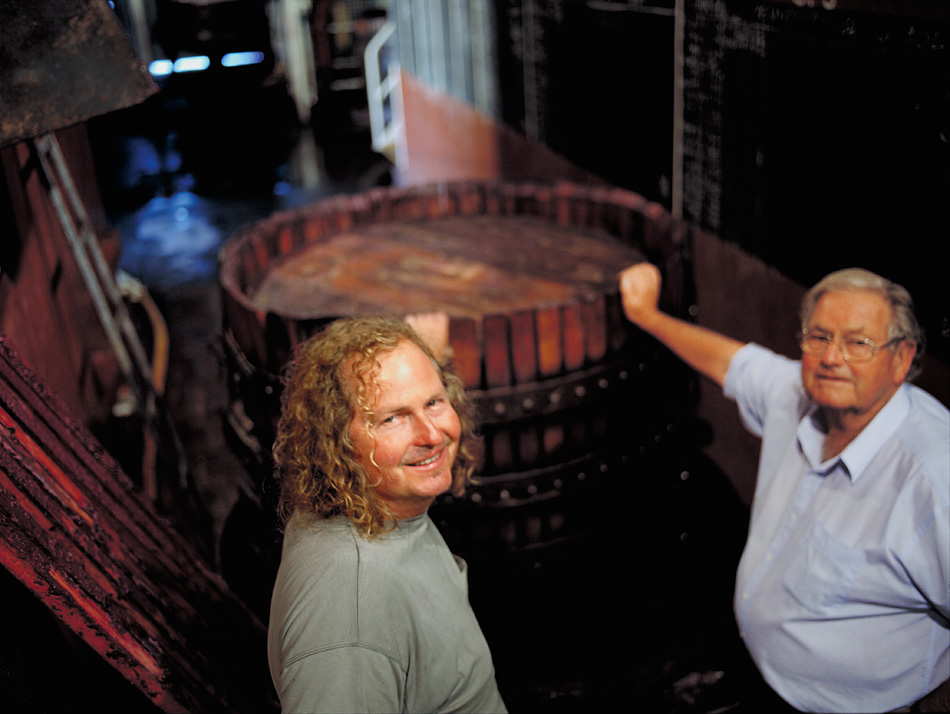 image of two men chester and d'arry Osborne in a winery cellar