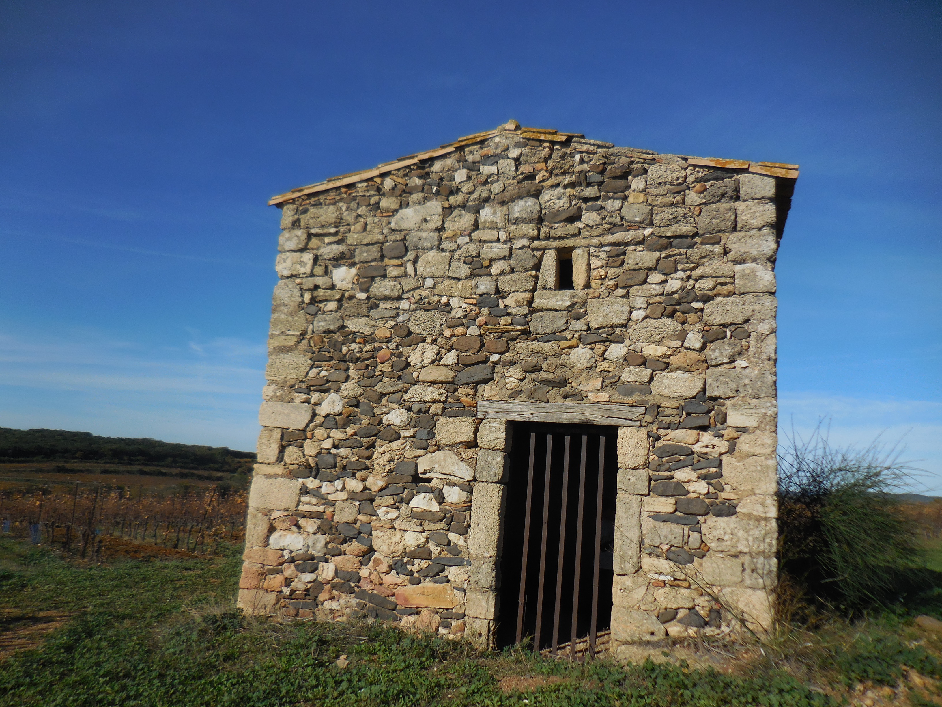 old stone building with blue sky
