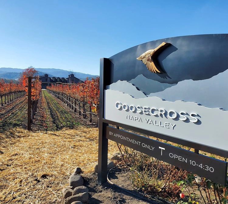 sign and vineyards