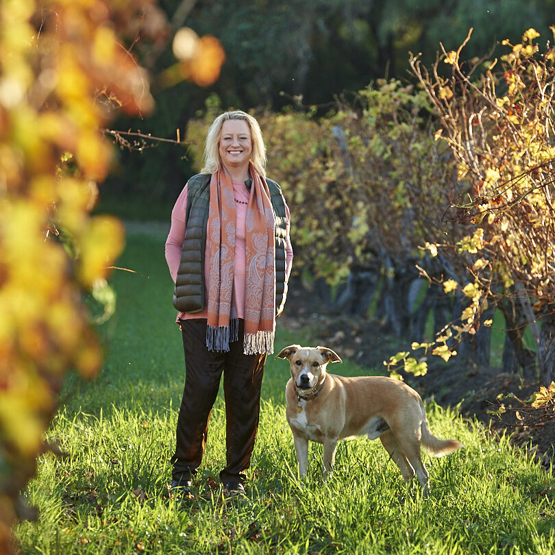 woman and dog in landscape