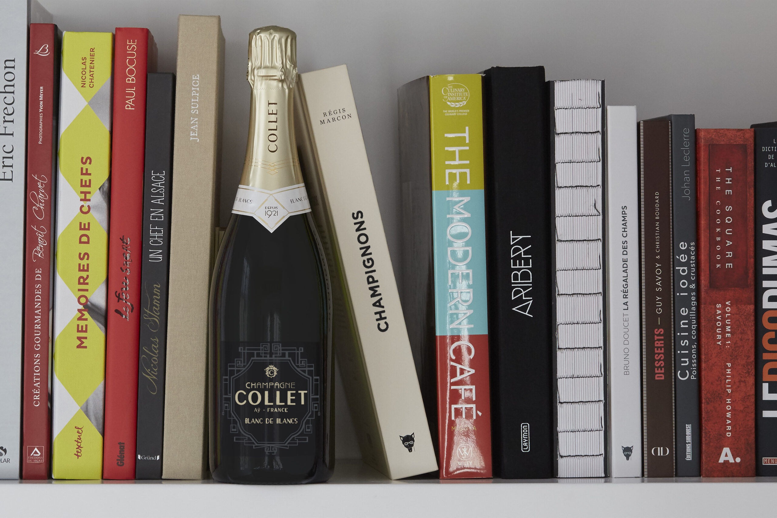 champagne on a book shelf